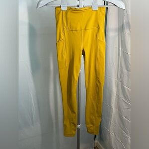 ATHLETA Ultimate Stash‎ pocket mustard yellow size XXS like new 7/8 length